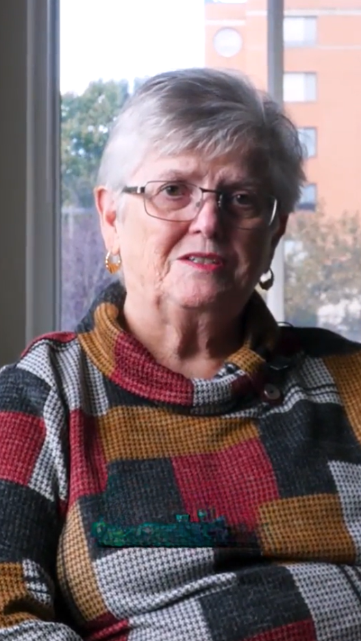 Senior woman in checkered sweater