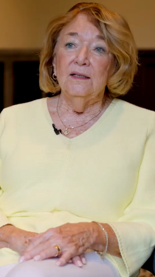 senior woman in yellow shirt