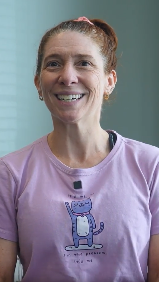 woman in pink shirt with cat on it
