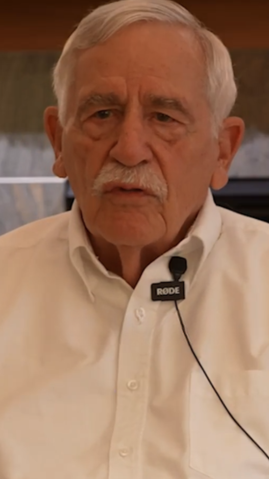 Senior man in white collard button shirt