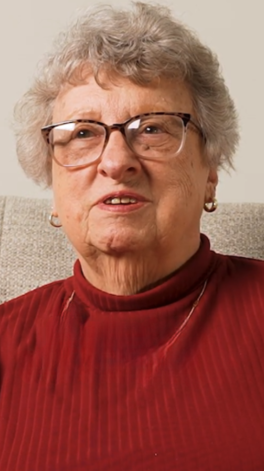 senior woman in red turtleneck